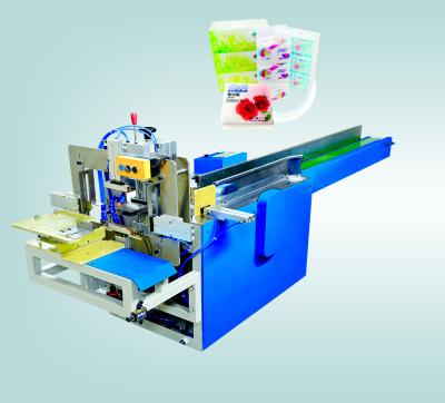 China Pre-made plastic bag semi-automatic napkin soft paper packing machine for sale