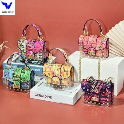 China Waterproof women's handbags and purses 2022 new graffiti chic ladies purse trend rivet purses for women for sale