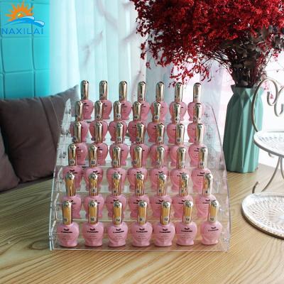 China NAXILAI Durable Acrylic Cosmetic Display Stand Nail Polish Rack Plastic Nail Polish Racks Wall Mounted for sale