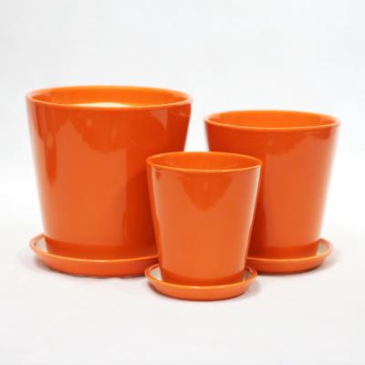 China Indoor Decor Handcrafted Orange Ceramic Pots With Drainage Holes for sale