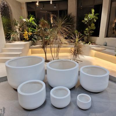 China Indoor Outdoor Smooth Fibre Clay Planter With Drainage Holes for sale