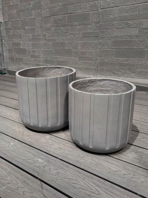 China Exquisite Hand Carved Fiber Clay Planter with Drainage Holes for sale