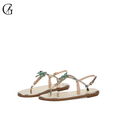 China Goxeou Fashion Trend New Fashion Women T-Strap Elegant Ankle Strap Sandals High Quality Rhinestone Flat Sandals For Ladies Summer Beach Gold for sale