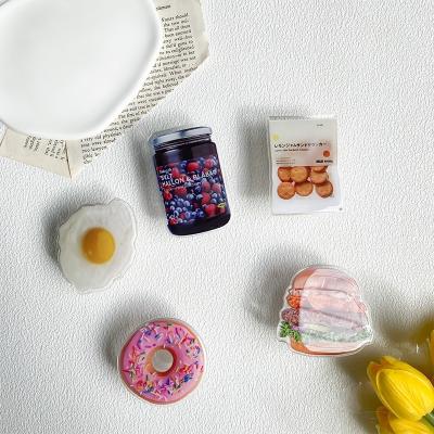 China Adjustable Favor Wholesale Phone Accessories Waffle Egg Burger Mobile Phone Grip Holder for sale