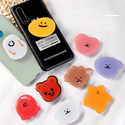 China Custom Adjustable Fashionable Promotion Gifts Shape Epoxy Resin Acrylics Poppings Phone Finger Grip Holder for sale