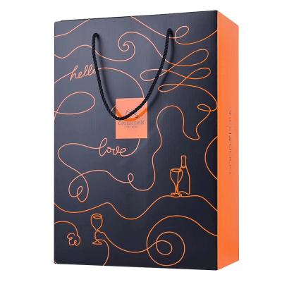 China Recycled Materials Luxury Custom Gold Printing Kraft Paper Wine Bottle Bag For Gift Packaging for sale