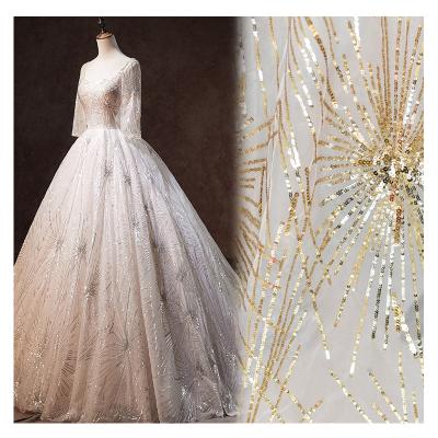 China Handmade luxury gold white sequins beaded bridal lace fabric with sequins for women wedding bridal dress for sale