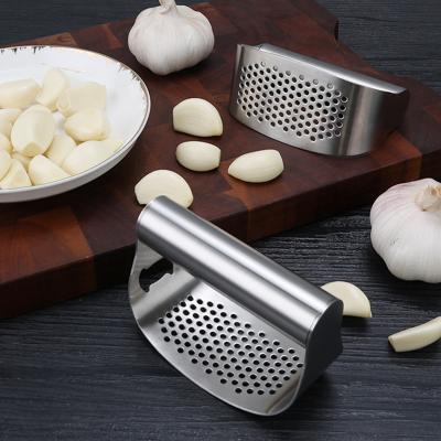 China Kitchen Tools Stainless Steel Garlic Press Ginger Garlic Crusher Multifunctional Viable Manual Garlic Crusher for sale