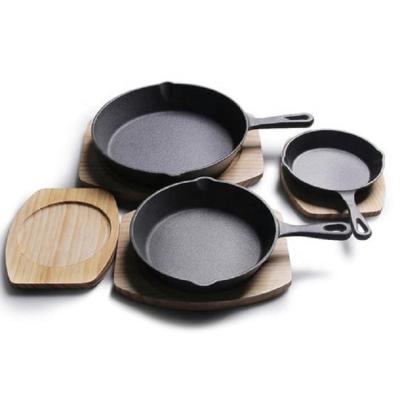 China Factory Cheap Seasoned Pre - Cast Iron 3pcs Fry Pan Long Lasting Pan With Wooden Base Tray for sale