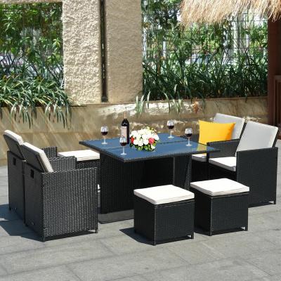 China Outdoor modern table and chairs rattan dining set with cushions for sale