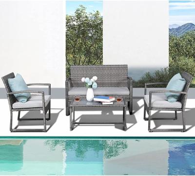 China Modern Hot Selling Rattan Dining Set With Cushions Rattan Table And Chairs 4 Piece Set for sale