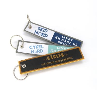 China Wholesale Decoration Textile Brands Cheap Low MOQ Custom Both Sides Call Logo Machine Woven Keychains For Souvenirs for sale