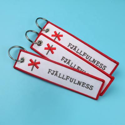 China Customized Wholesale Customized Fabric Double Side Logo Promotion Gift Textile Key Eco - Friendly Tags Embroidery Keychains for sale