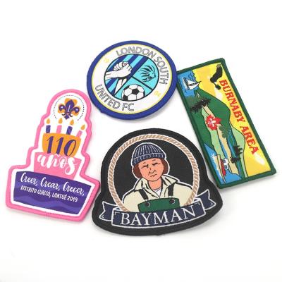 China Handmade Wholesale Custom Brand Badges Black Felt Supporting Club Uniforms Woven Patches With Merrow Border for sale