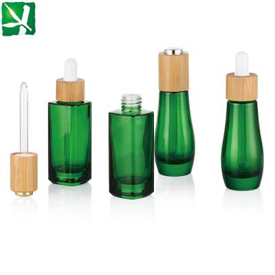 China 30ML Skin Care Essential Oil Cream Glass Bottle With Bamboo Dropper for sale