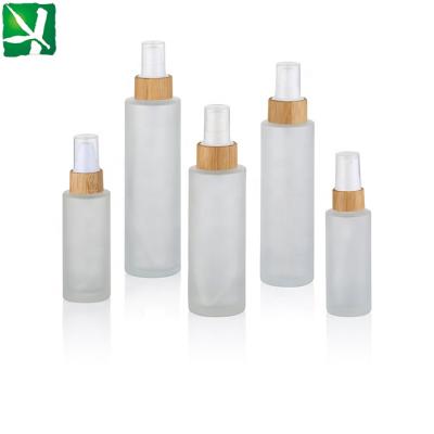 China 30ml/50ml/100ml/120ml/150ml eco-friendly frosted glass lotion bottle, glass bottle with bamboo lid for sale