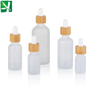 China 2020 New Cosmetic Packaging Essential Oil Frosted Glass Bottle With Bamboo Dropper for sale