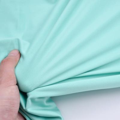 China Anti Pill 87% Polyester 13%Spandex Green Softness Hand Smell Antimicrobial Sportswear Recycle Fabric Spandex Stretch Fabric for sale