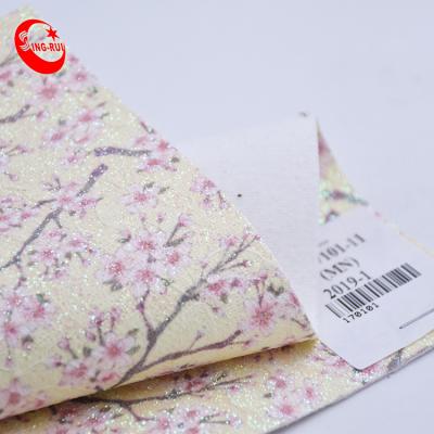 China Custom Wrinkle Resistant Flower Pattern Peach Flower Printing Faux Leather Glitter Blingbling Woven Fabric For Bags Shoes Decoration Wallpaper for sale