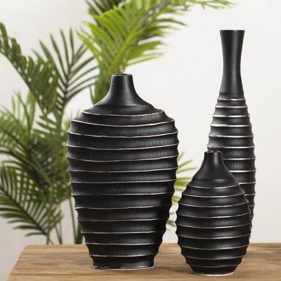 China Wholesale Cheap Unique Handmade Shape Resin Vase Customized Elegant Design Black Wine Bottle Holder for sale