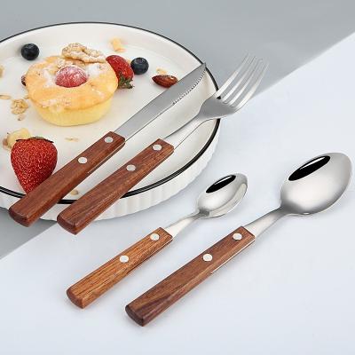 China Stored Restaurant Home Use 18/10 Stainless Steel Silver Cutlery Set Rose Wood Handle Spoon Fork Knife Set Flatware Set for sale