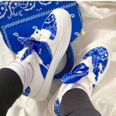 China Latest Casual Round Skateboarding Shoes Canvas Bow Ladies Walking Boat Sport Silk Women Flat Shoes for sale