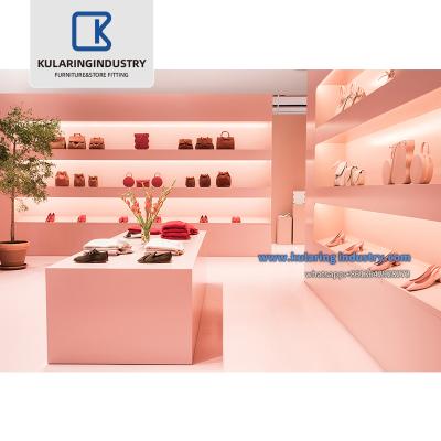 China Fashionable retail store trade show handbags stand display lady bags showcase for handbag shop furniture with pink style for sale