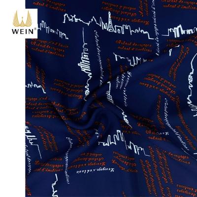 China WI-B08 Navy Blue Tear-resistant Fashionable Polyester Woven Foam Crepe Soft Character Printed Shirting Fabric For Garment for sale