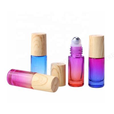 China Personal Care 5ml 10ml DIY Gradient Glass Roll On Essential Oil Bottles With Bamboo Caps Plastic Screw Caps Cobalt Blue Screen Printing 30g/pc for sale