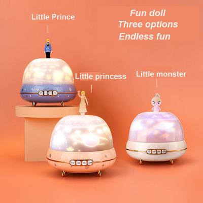 China Cartoons Rotating Projector Light Music Box Starry Night Lights Bluetooth Table Lamp Projectors for sale