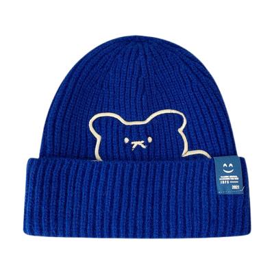 China Bear embroidery hat winter hearing protection face fabric COMMON cute woolen female warm smiling label knitted hat student for sale