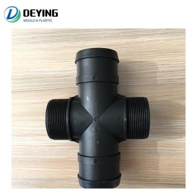 China Plastic Pipe Fitting Valve Plastic Four Way Injection Mold for sale