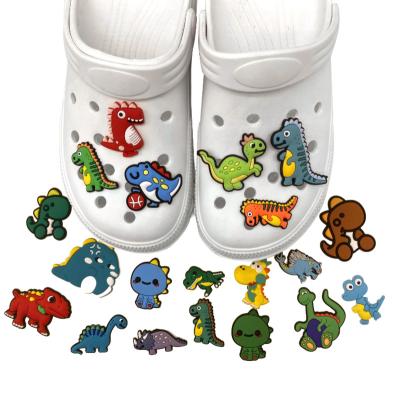 China Clog Charm 2023 Hot Sale Cartoon Dinosaur PVC Clog Charms Shoe Accessories Fit Bracelets Clog Clog Charms Kids Gift for sale