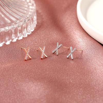 China New FASHIONABLE free sample simple cross earrings, cool and small diamond small inlaid letter X earrings, very simple student earrings for sale