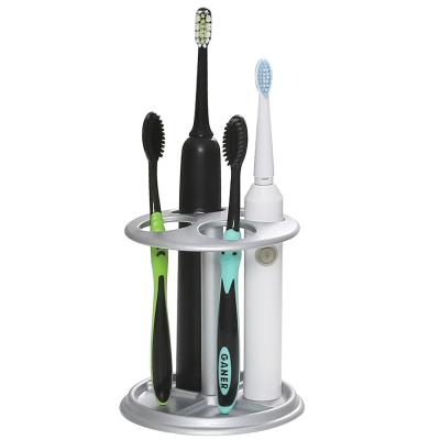 China Multifunctional Viable Bathroom Organizer Metal Toothbrush Holder Toothpaste Dispenser Holder for sale