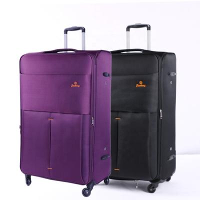 China Long Distance Travel Personalized Carry On Traveling Trolley Luggage Carry On Traveling Trolley Bag Purple Suitcase Anti Valiz Water Bag for sale