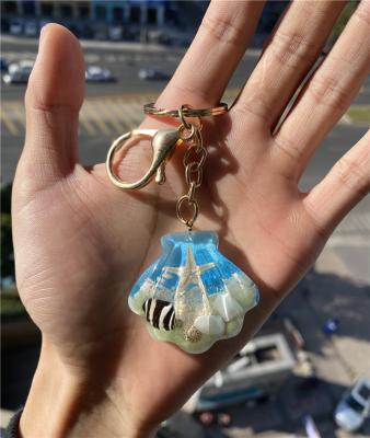 China New Luminous Epoxy Resin Conch Metal Shell Starfish Keychain Pendant Artificial Chain Key Features for sale