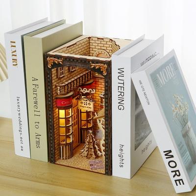 China Cartoon Toy Low Price Handmade Bookshelf Insert Wooden 3d Puzzle Dollhouse Accessories With Led Light Book Nook for sale