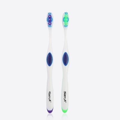 China Disposable popular tube adult toothbrush with a tongue cleaner for sale