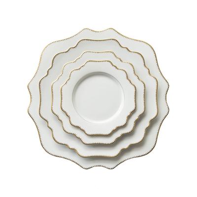 China Viable Luxury Wedding Porcelain Decorative Serving Plates White Flower Gold Rim Ceramic Charger Dish Set for sale