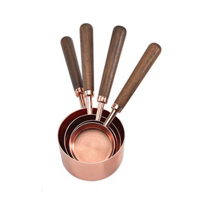 China Sustainable Stainless Steel Kitchen Tools Rose Gold 4PCS Wooden Walnut Handle Baking Measuring Cups And Spoons Set for sale