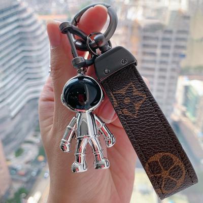 China Astronaut Pendant Luxury Hand Strap Car Keychain Leather America Astronaut America Metal School Bag Small Ornament Creative Gift for sale