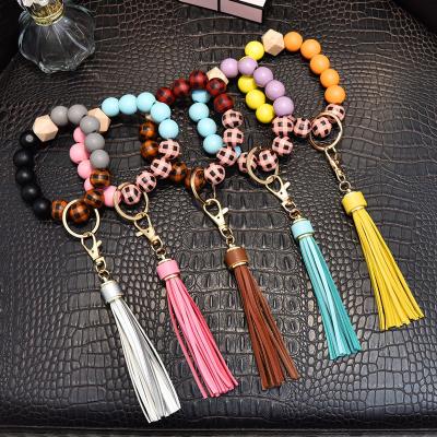 China Custom Retro Silicone Beads Elastic Wristband Bracelet Key Chain Tassel Leather Silicone Beads Wristband Bracelet Key Chain for sale