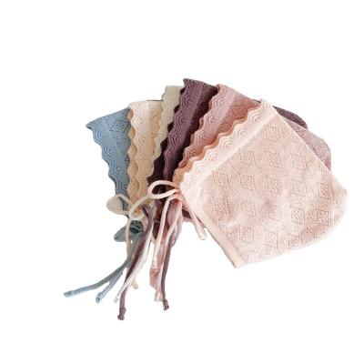 China Knitting Dobby Solid Colored Cotton Hats Newborn Infant Girls Lace Up Pointelle Cowl Pixie for sale