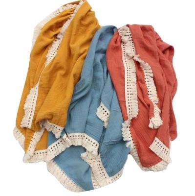 China Sustainable Soft Newborn Baby Bathsuits Wraps Solid Muslin Crepe Cotton Tassel Covers Wraps for sale