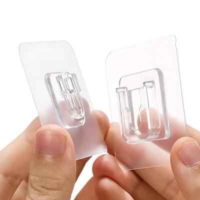 China Viable Clear Bonding Transparent Waterproof Self Adhesive Hook Double Sided Puching Traceless Wall Adhesive Hooks For Storage for sale