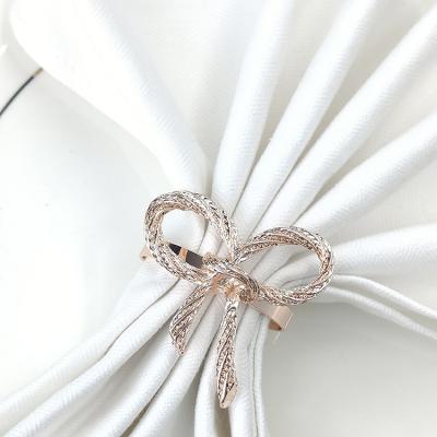 China Viable Dinner Accessories Metal Napkin Ring Holder Rose Gold Bow Tie Napkin Rings For Birthday Party Wedding Table Decor for sale