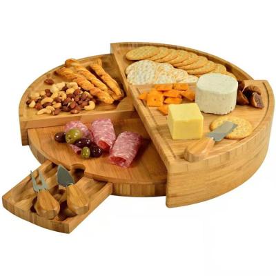 China Revolving Round Acacia Wood Cheese Board Serving Tray With Stainless Steel Cutlery for sale