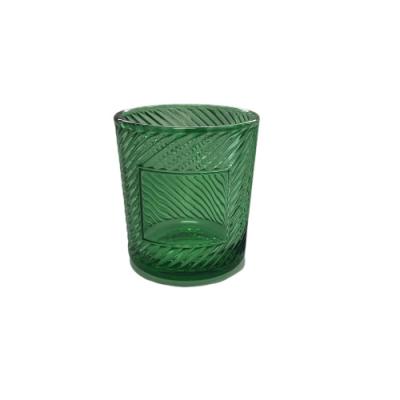 China OEM Old Fashioned Empty Green Glass Candle Holder Beautiful Crystal Tea Light Votive Embossed Home Decor for sale