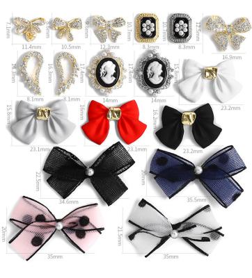 China Japanese Glass 3D Nail Bow Ornament Frosted Alloy Finished Sliver Nail Ornament for sale